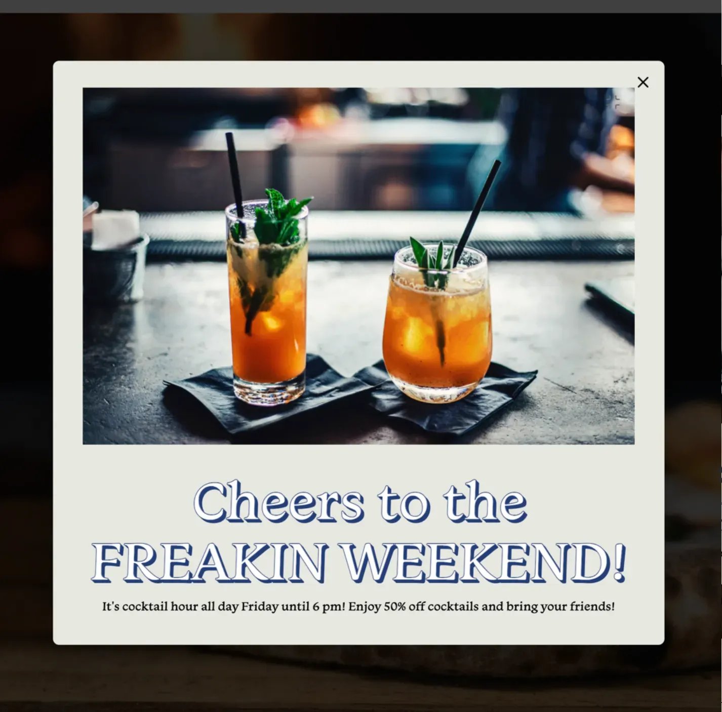 A Popmenu website pop-up promoting “Cheers to the freakin weekend” with 50% off cocktails all day Friday